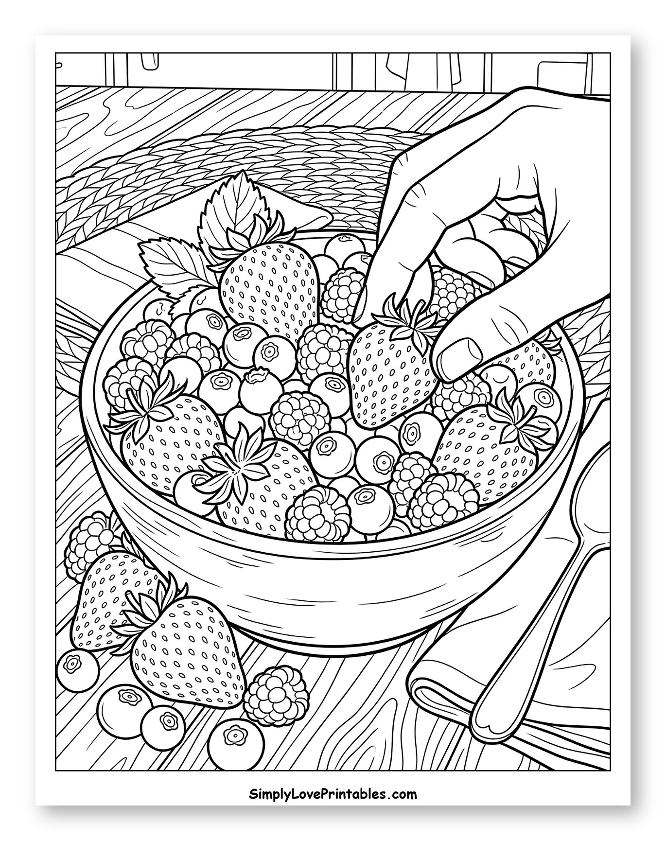 Hand Adding Strawberry to Berry Bowl